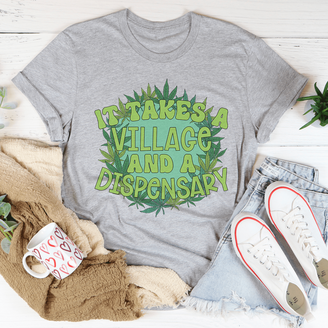 Heather gray crewneck T-shirt with front green 'Take a Village and a Dispensary' graphic