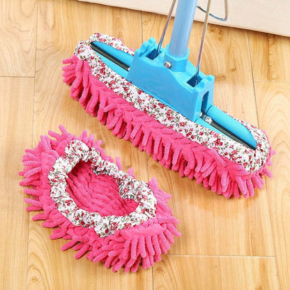 Pair of pink slip-on mop slippers with white patterned trim and fringed soles.