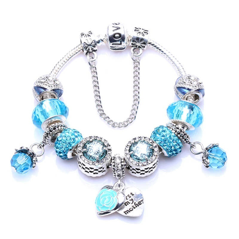 Silver charm bracelet with blue rhinestone beads and oval heart clasp charm