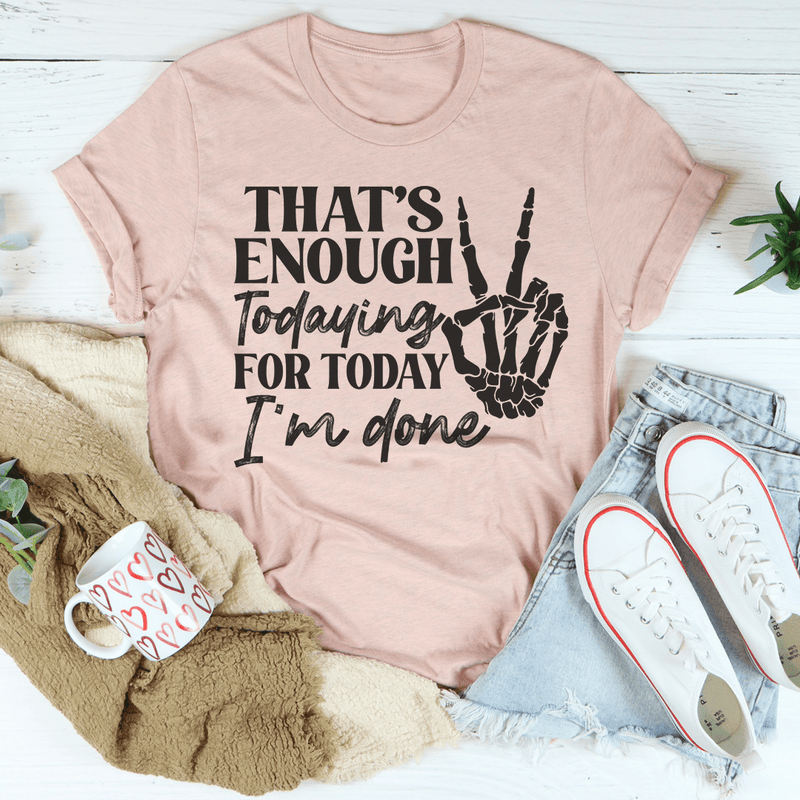 Mauve T-shirt with black 'That's enough' handprint graphic on front.