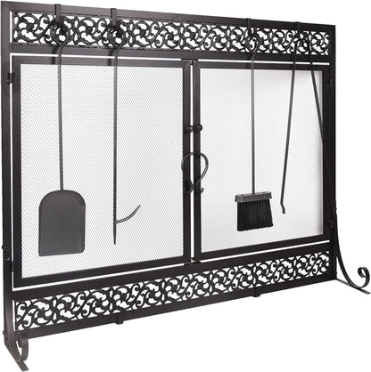 Black metal fireplace screen with two mesh doors and decorative scrollwork frame