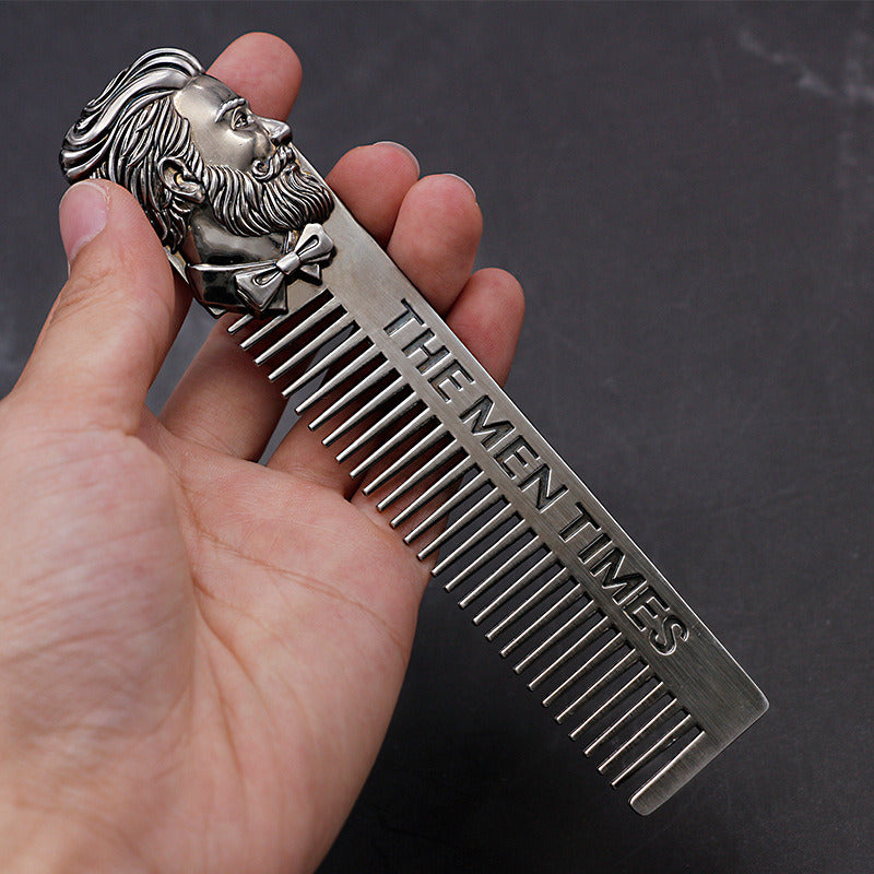 Stainless steel comb with fine teeth and lion-face handle, dark metallic finish