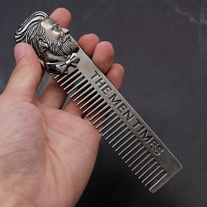 Stainless steel comb with fine teeth and lion-face handle, dark metallic finish