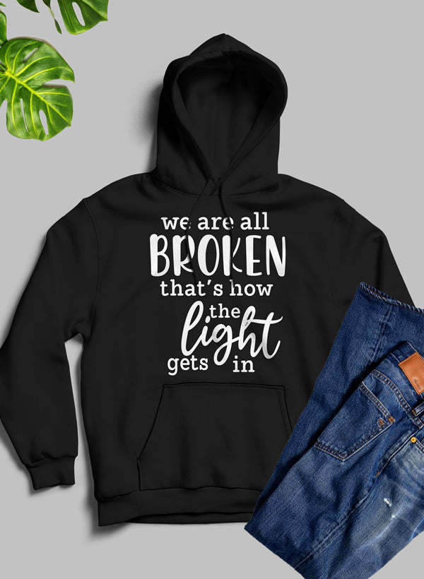 Black pullover hoodie with drawstring hood, front 'BROKEN' graphic, and kangaroo pocket