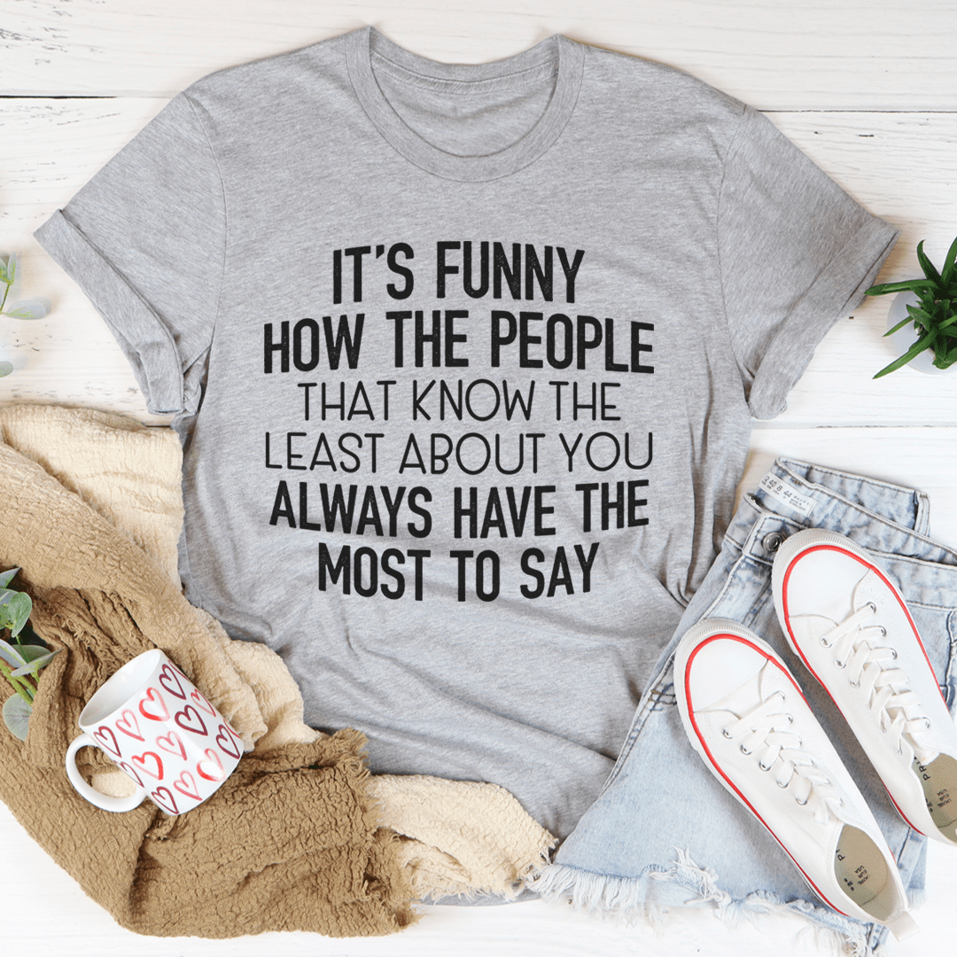 Heather gray crewneck graphic t-shirt, short sleeves, bold black slogan on front