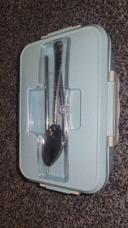 Blue bento box open with utensil holder and two compartments