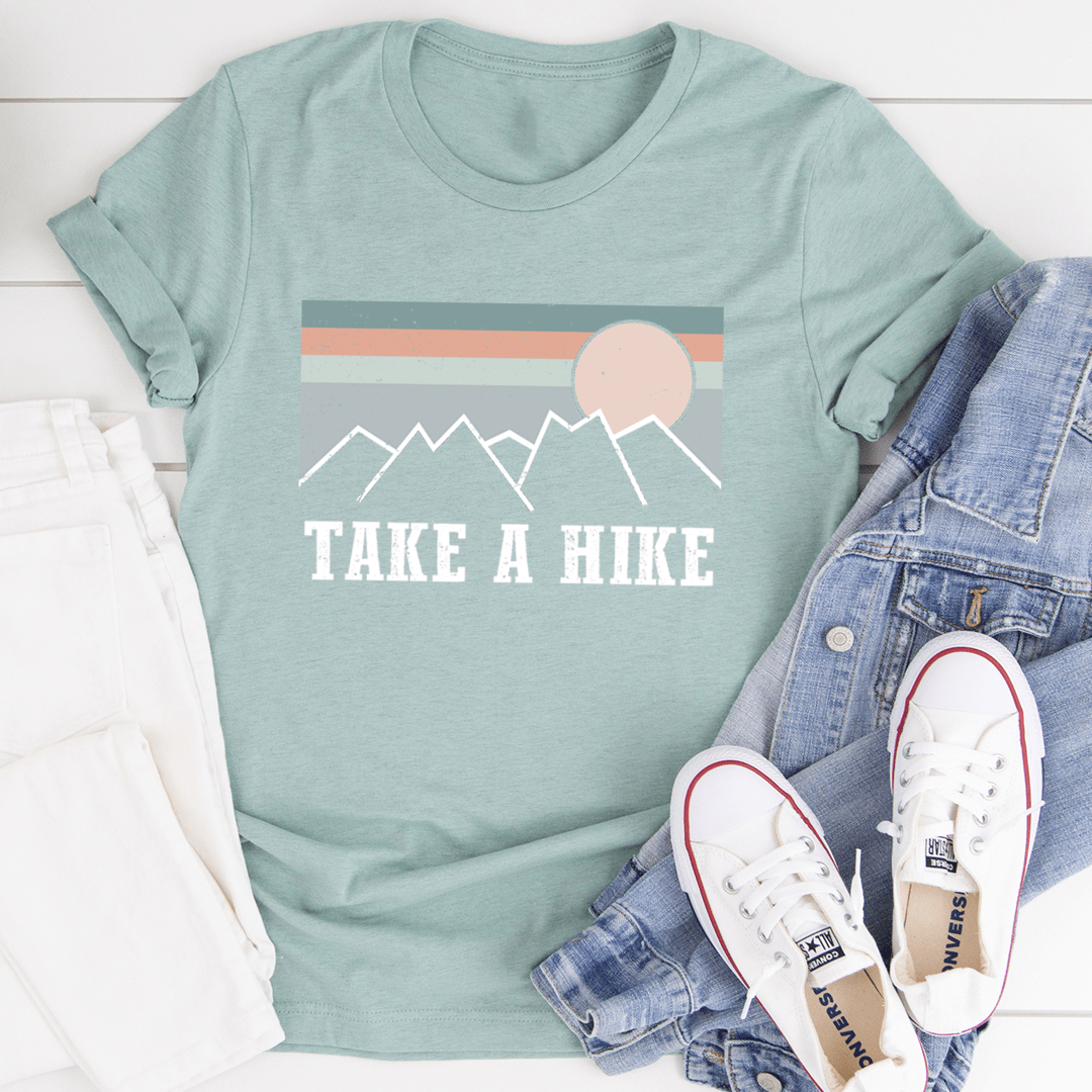 Dusty blue crewneck graphic t-shirt, mountain-sun design with TAKE A HIKE text