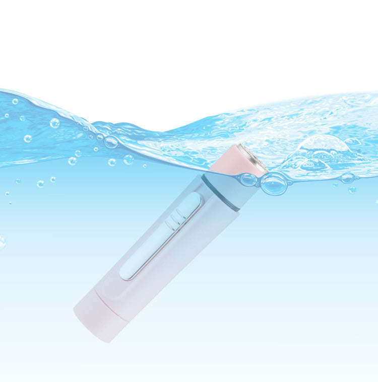 Pink grooming wand with foil-style metal attachment and water splash effect