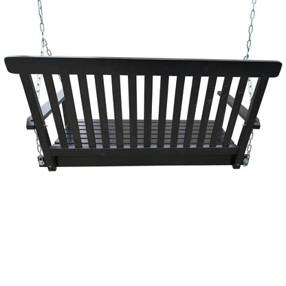 Black wood bench swing with slatted seat and back, hung by two chains.