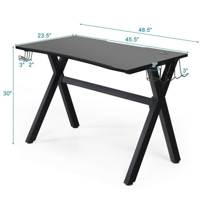 Black gaming desk with headphone hook and under-desk cup holder, size shown