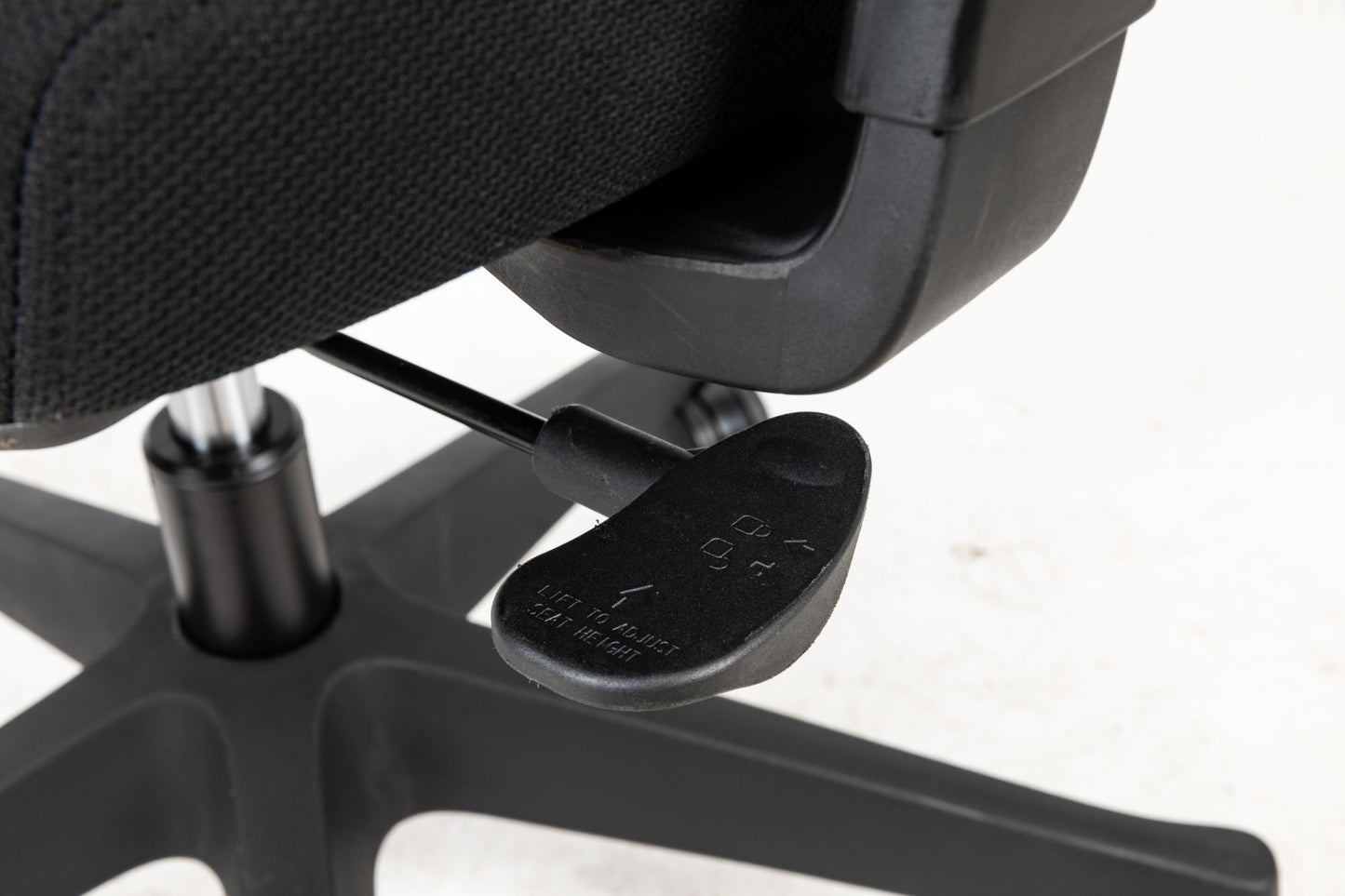 Office chair armrest and underside control lever with adjustment plate