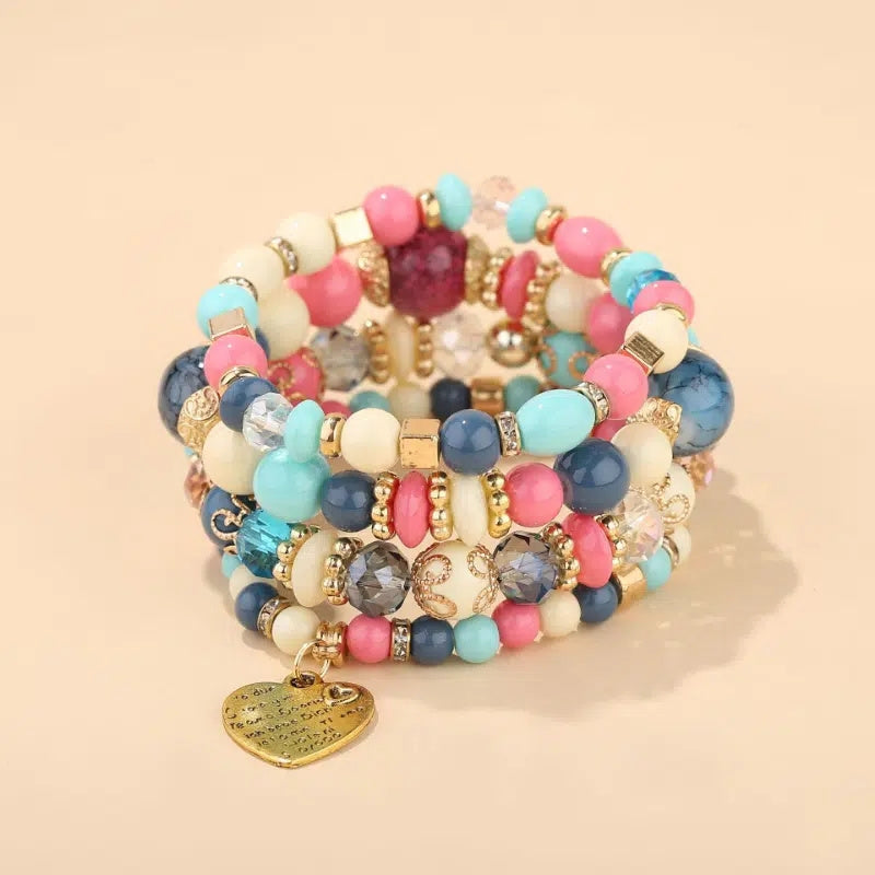 Layered colorful bead bracelet set with heart pendant charm, pink and teal beads