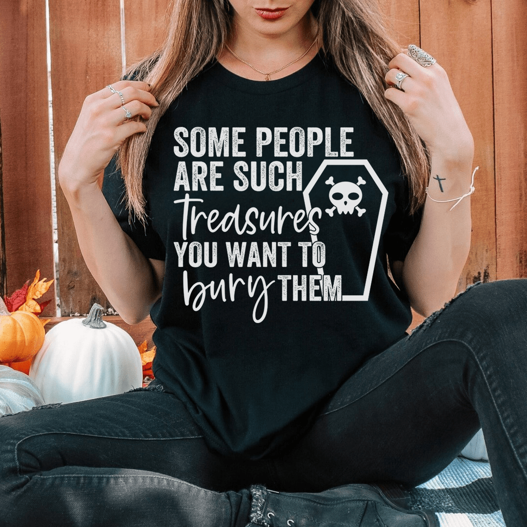 Black crewneck T-shirt with skull-and-treasure quote graphic on the front
