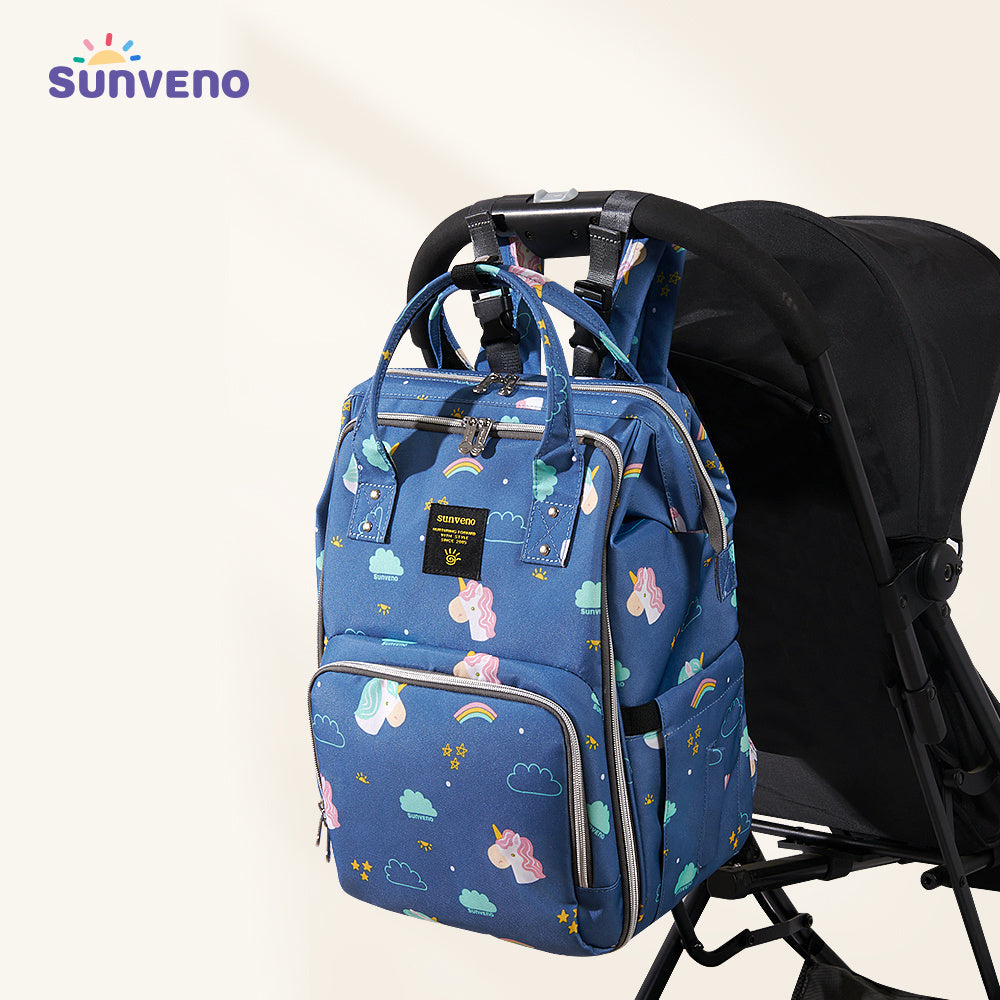 Blue patterned diaper bag backpack with stroller straps and side pockets