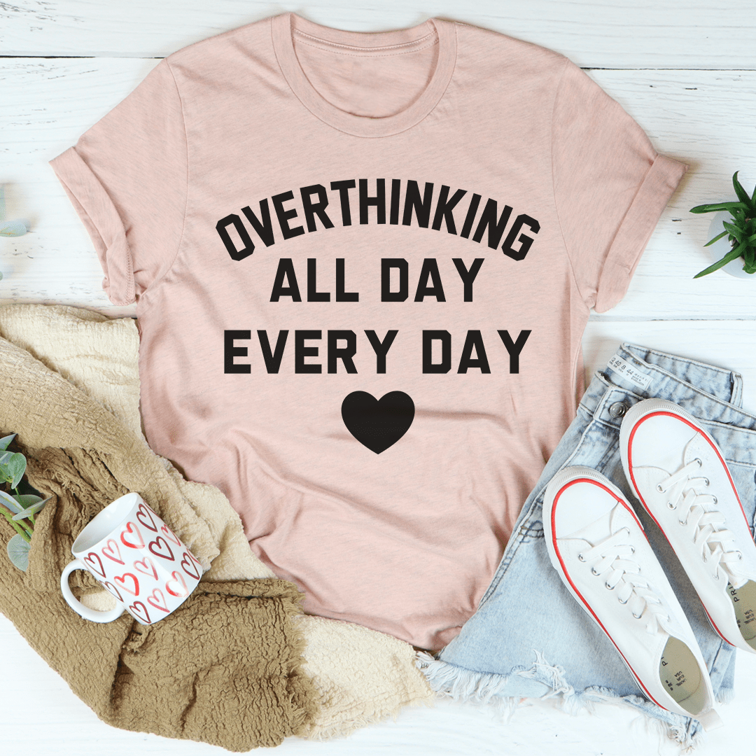 Peach T-shirt with 'OVERTHINKING ALL DAY EVERY DAY' text and heart graphic