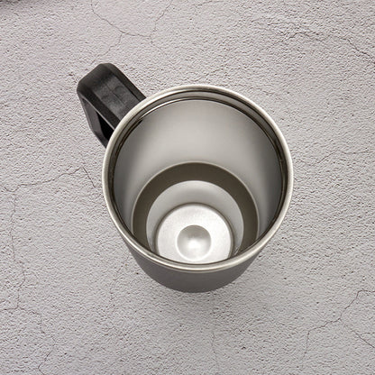 Dark stainless travel tumbler with handle and open lid, top view