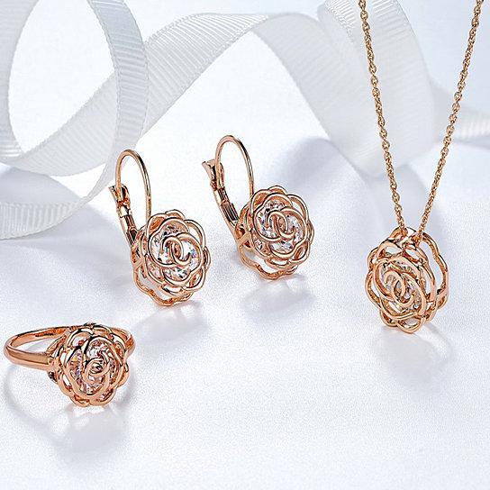 Rose gold crystal ring, matching stud earrings, and rose-style pendant on chain