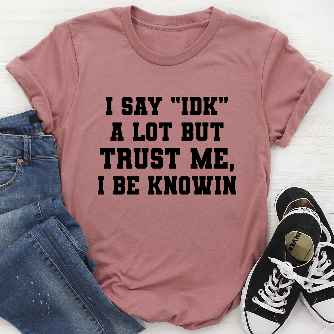 Mauve crew-neck T-shirt with bold black statement graphic, 'I SAY "IDK"' text.