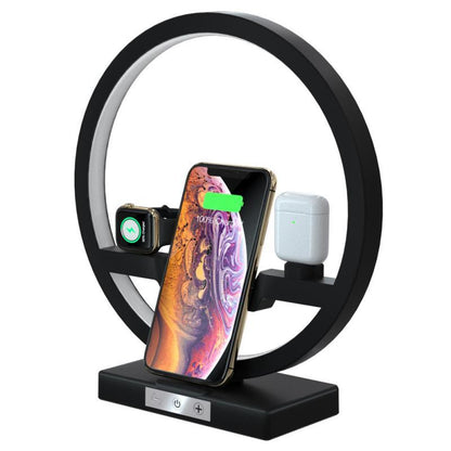 Wireless charger stand with black ring, smartphone, watch, and earbuds charging pads