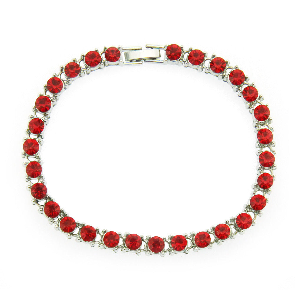 Red rhinestone link bracelet with silver-tone rectangular clasp and round stones