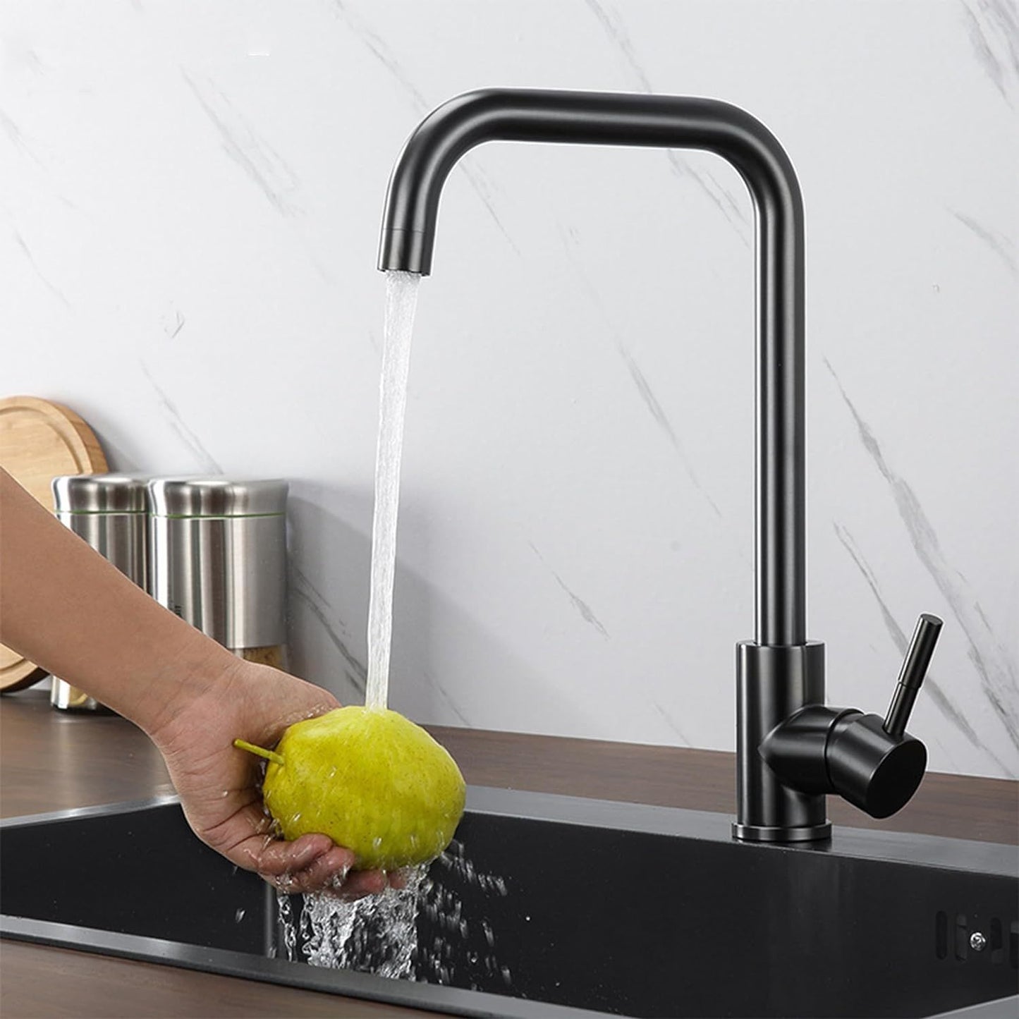 Pull-down kitchen faucet with water stream and side sprayer nozzle over sink