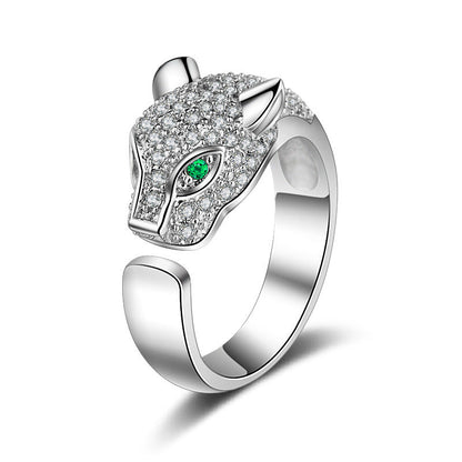 Silver open fox ring with green oval center and dense pavé stone band