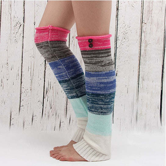 Multi-color socks with white base, pink ribbed cuff, dark gray and blue stripes.