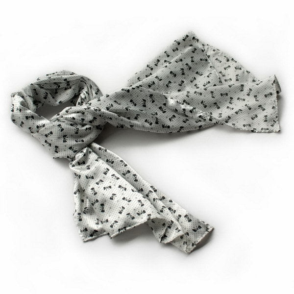 White silk scarf wrap with black bowknot print and tied bow detail