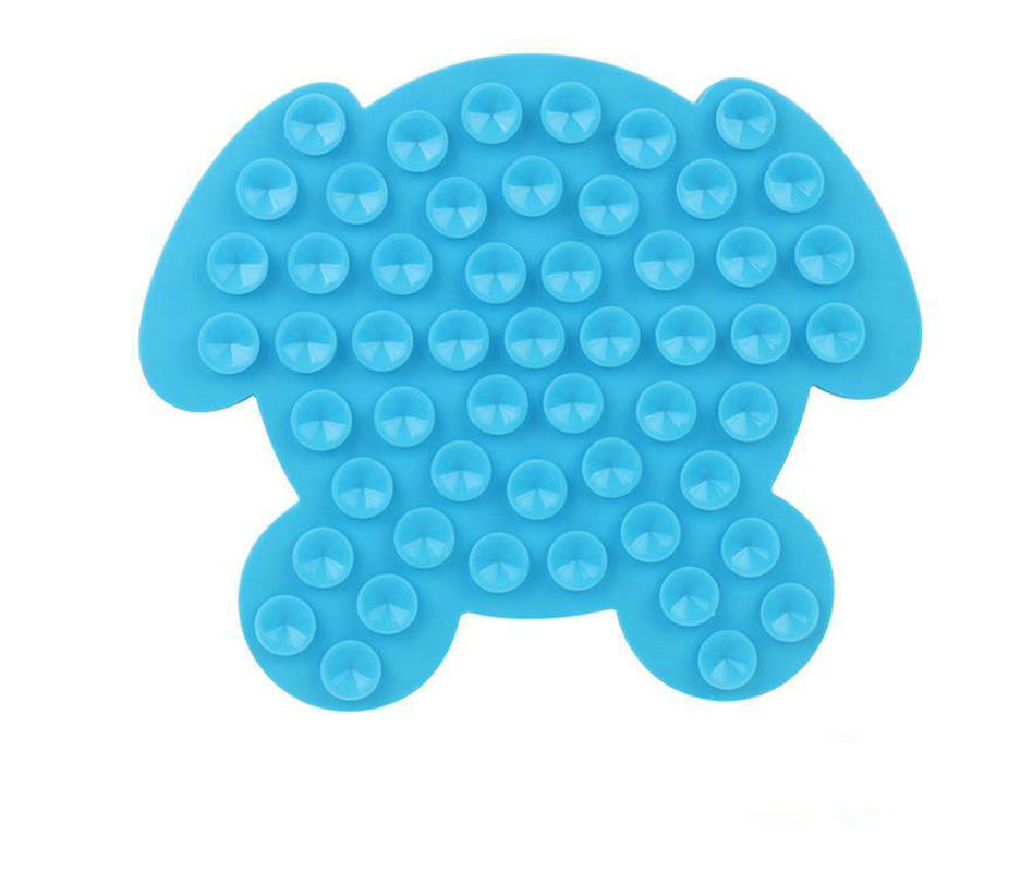 Blue bone-shaped dog lick mat with raised circular nubs across the surface