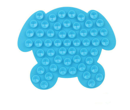 Blue bone-shaped dog lick mat with raised circular nubs across the surface