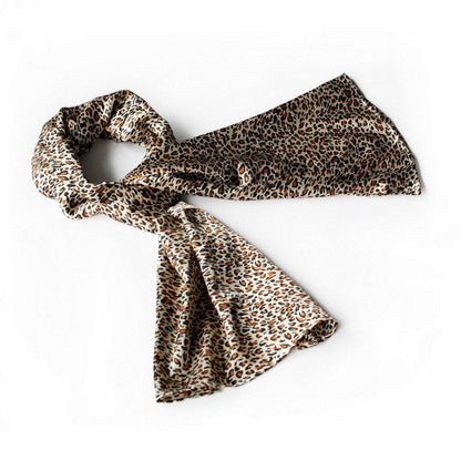 Large leopard-print soft scarf wrap in natural tones, long twisted ends