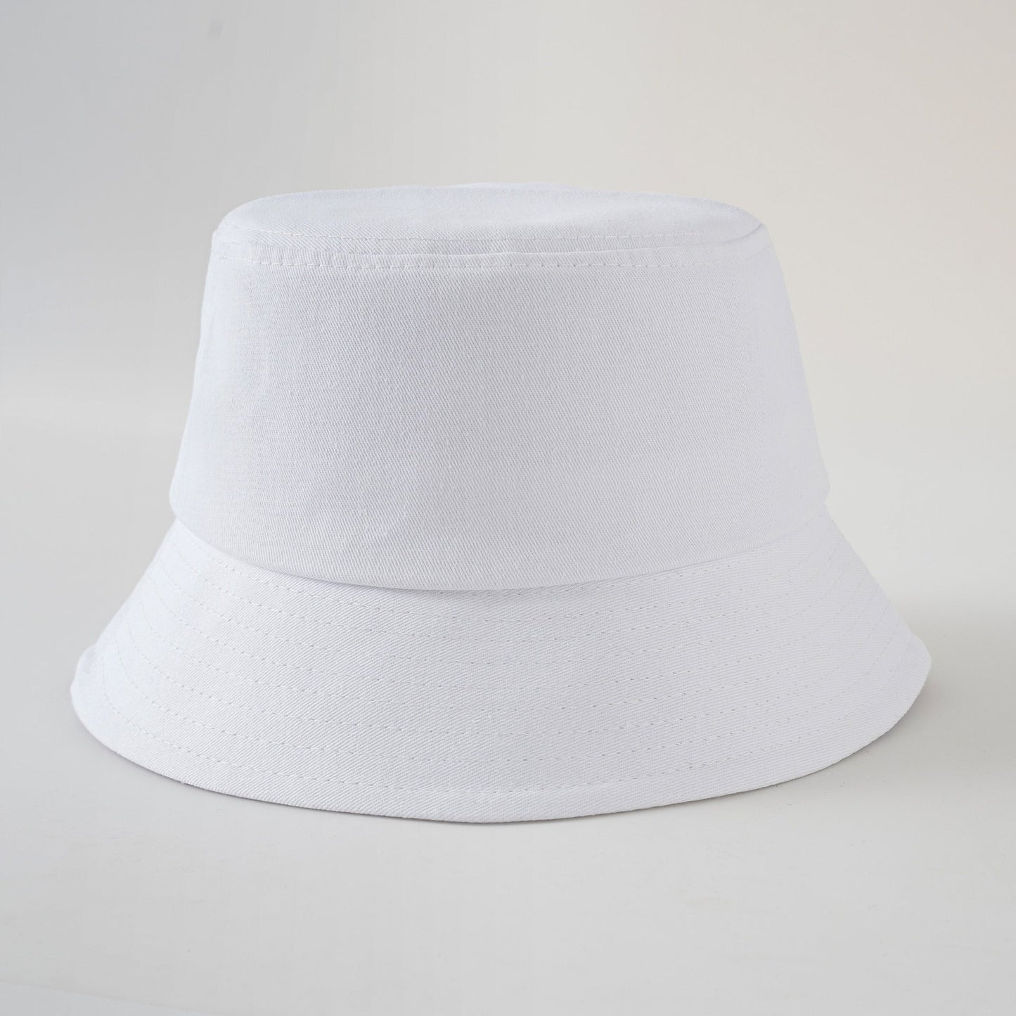 White fisherman hat with short brim and stitched band, clean solid color basin hat