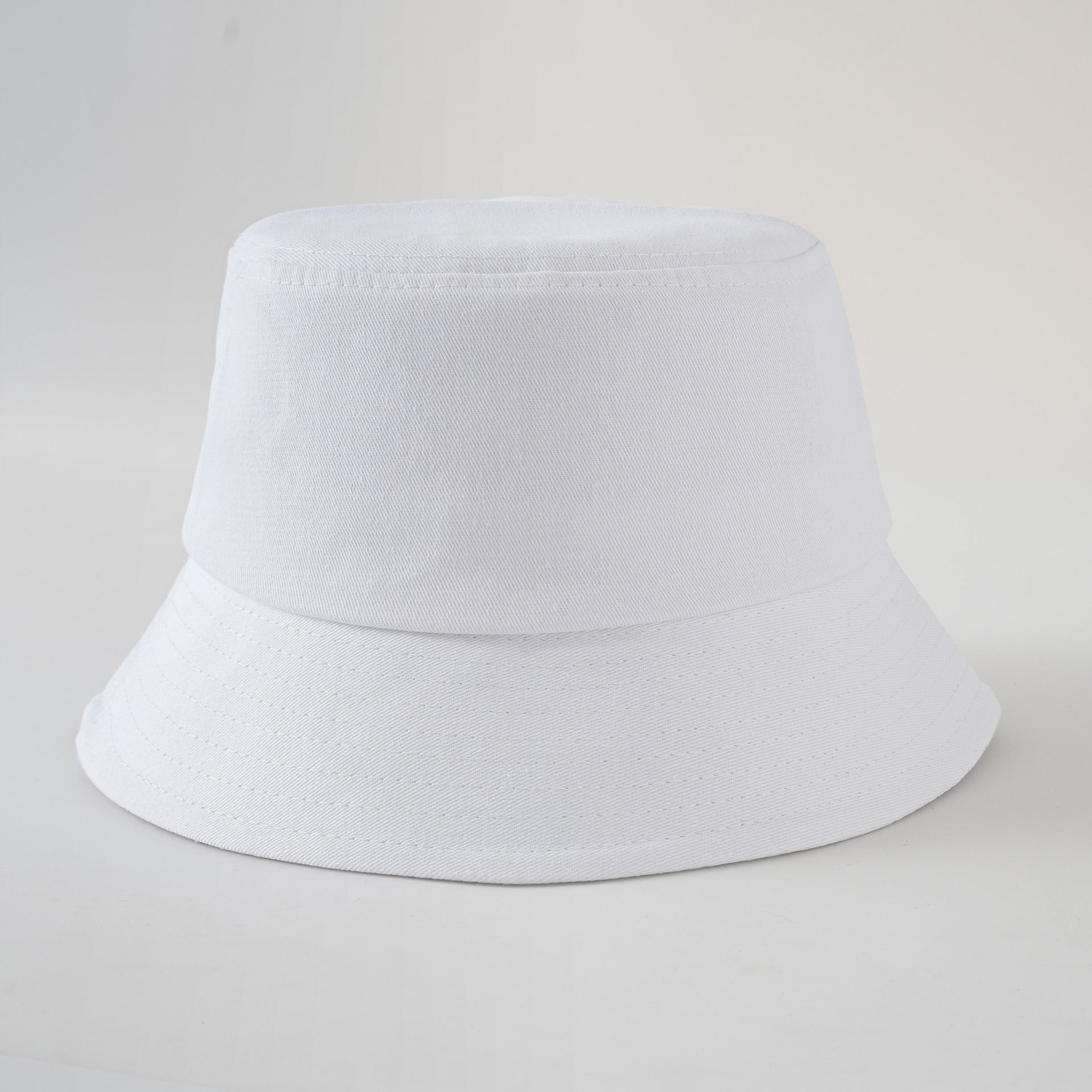 White fisherman hat with short brim and stitched band, clean solid color basin hat