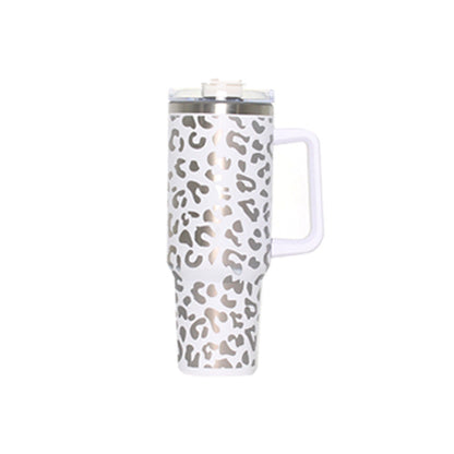 White insulated travel tumbler with handle, clear straw lid, leopard print