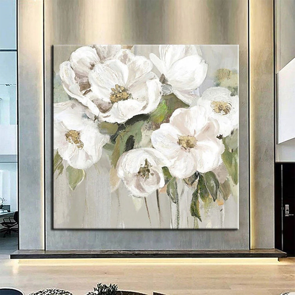 Framed floral oil painting showing white flowers with gold centers and green leaves