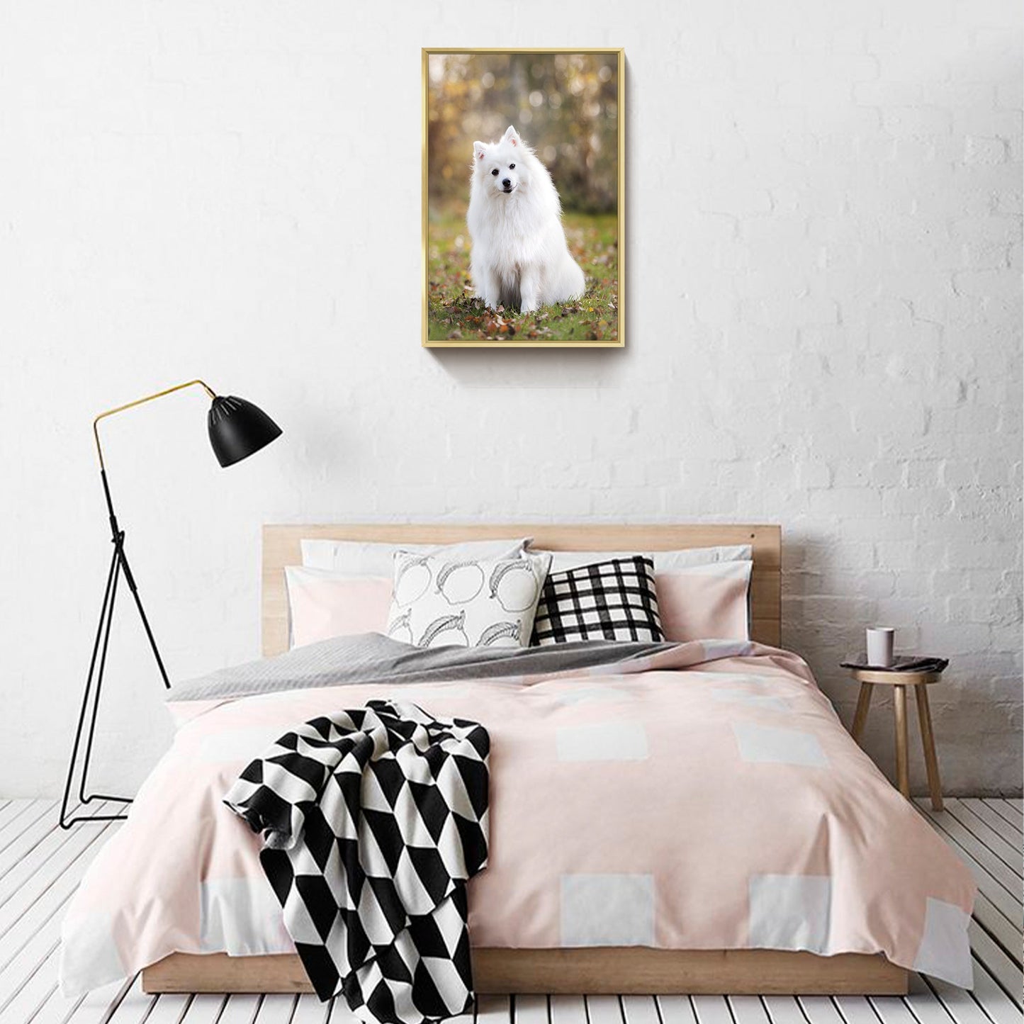 Gold-framed pet photo canvas wall art above a bed with bedding and pillows