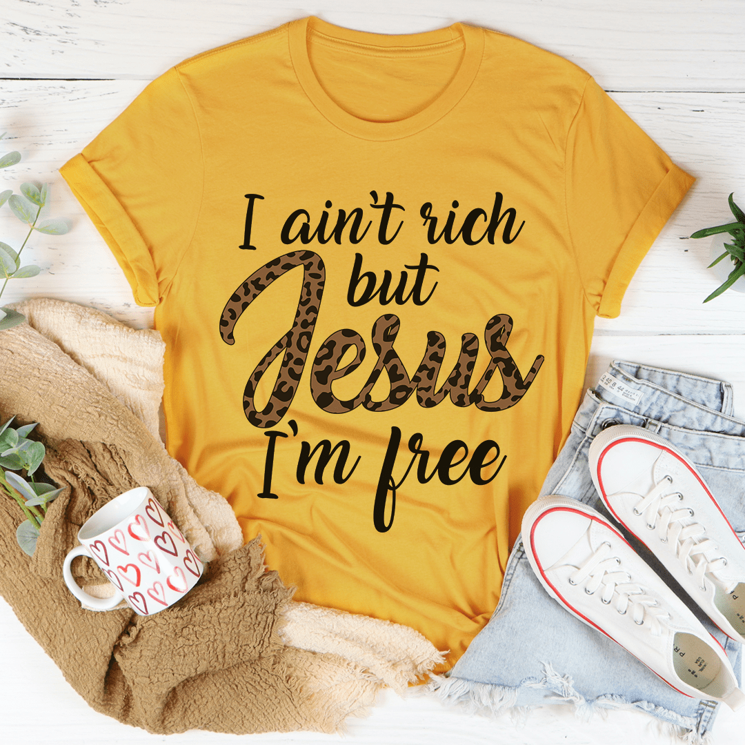 Mustard T-shirt with front text print: “I ain’t rich but Jesus I’m free”