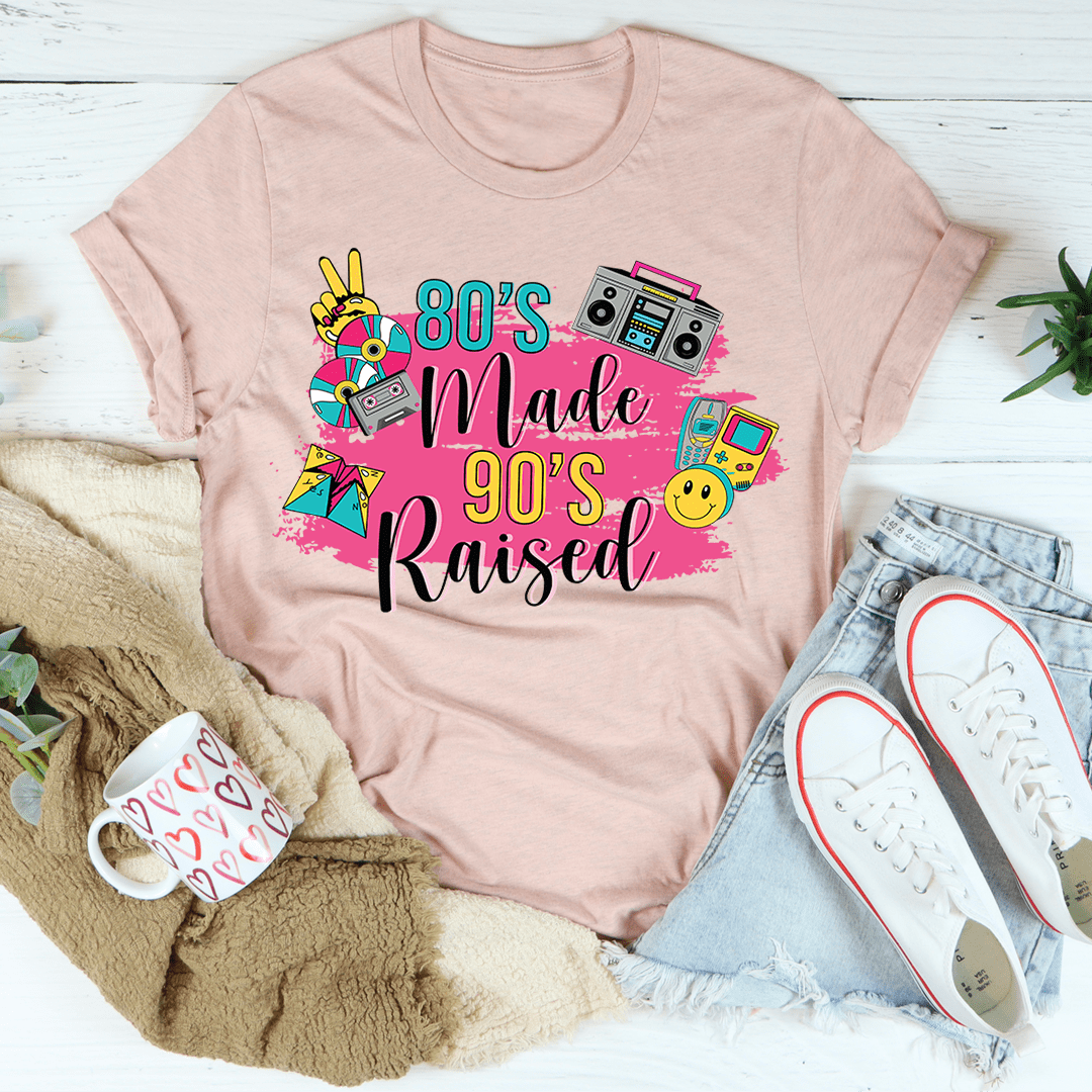 Heather peach crewneck T-shirt with "80's Made 90's Raised" graphic