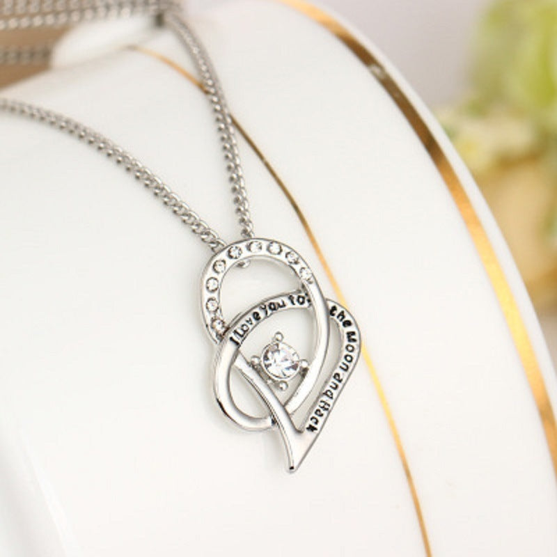 Sterling silver heart pendant necklace with cubic zirconia in a circle of clear stones