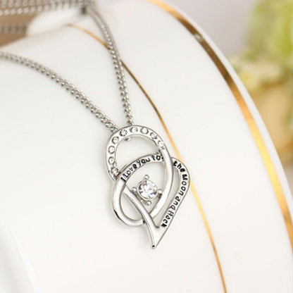 Sterling silver heart pendant necklace with cubic zirconia in a circle of clear stones