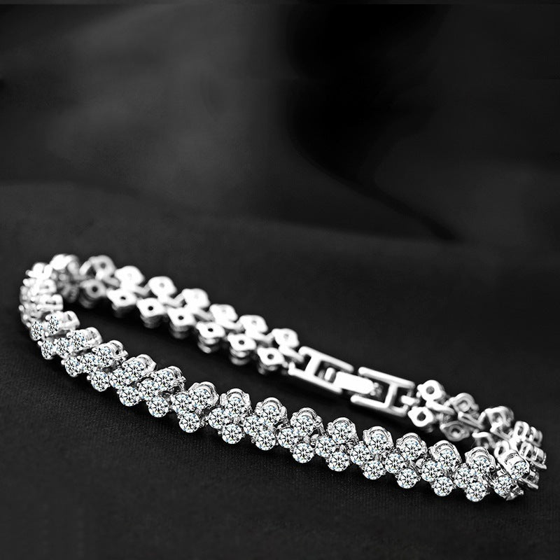 Silver tennis bracelet with repeating round stones and connected links