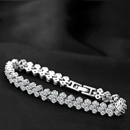 Silver tennis bracelet with repeating round stones and connected links
