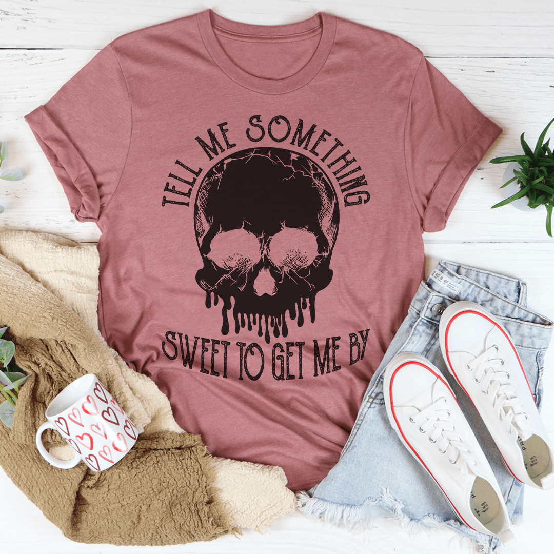 Peach T-shirt with black skull graphic and 'SWEET TO GET ME BY' text