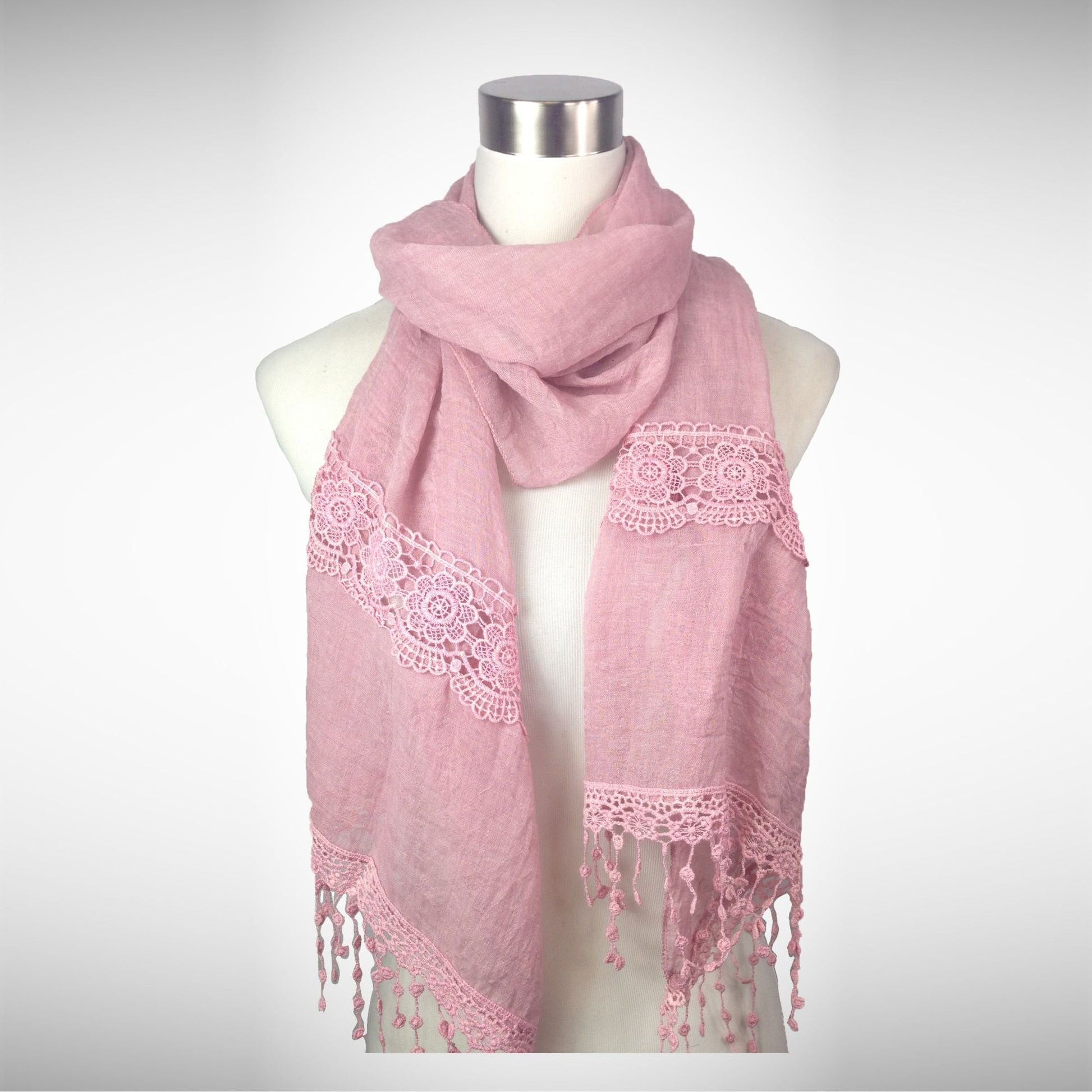 Dusty rose lace-trim scarf with embroidered detailing and tassel fringe, worn-style display