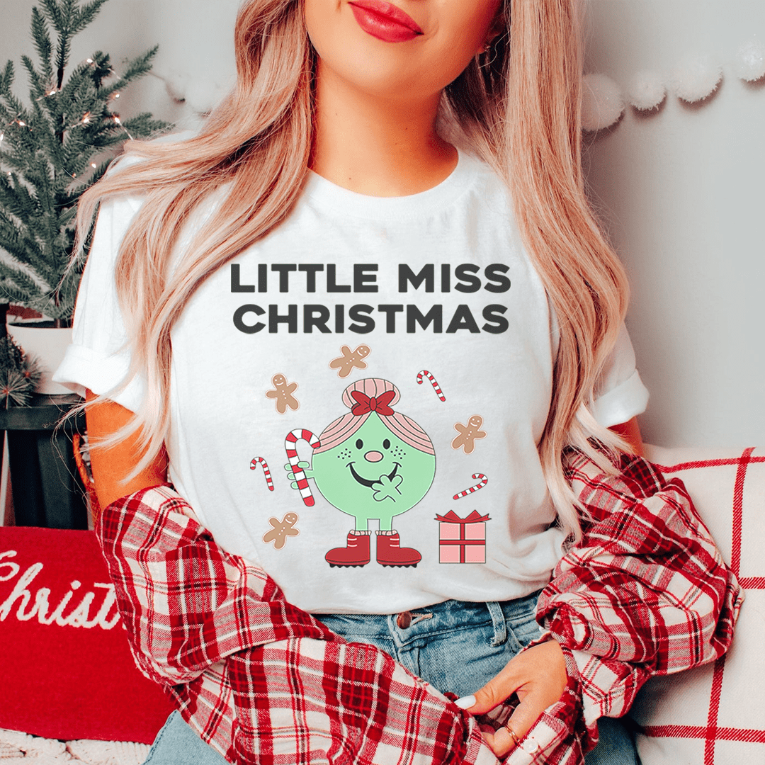 White crew-neck kids' Christmas T-shirt with 'Little Miss Christmas' text and elf graphic