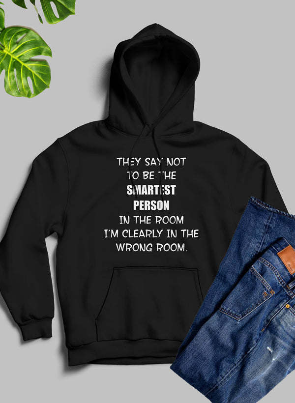 Black pullover hoodie with front hood and kangaroo pocket, white statement text