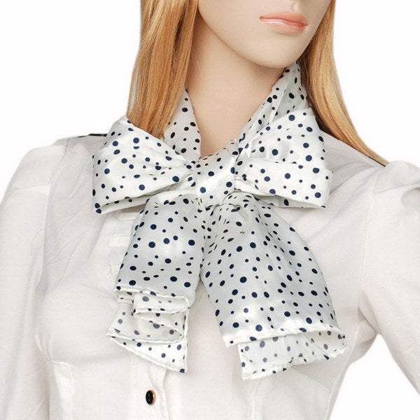 White silk scarf with small black dot pattern, bow at collar