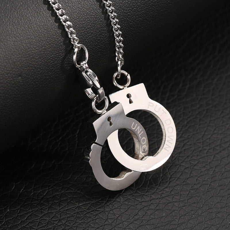 Handcuff pendant necklace with split handcuff pendant and clasped chain rings