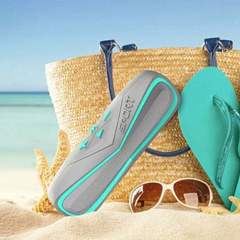 Waterproof Bluetooth speaker, gray with teal border and top strap loop