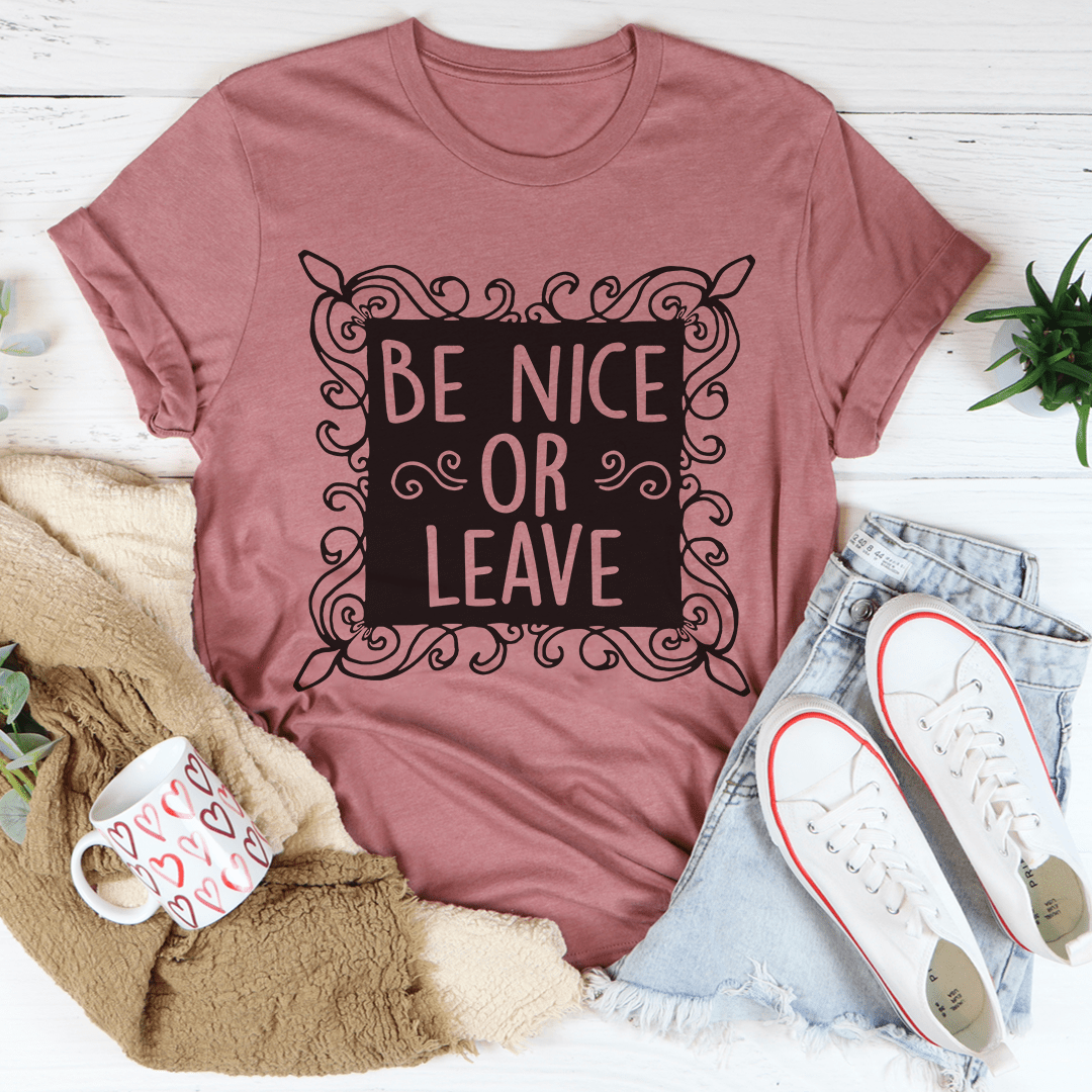 Graphic slogan T-shirt in mauve pink with ornate "Be Nice or Leave" front print